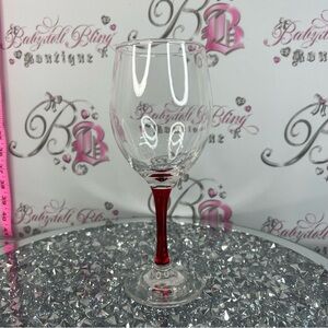 Clear Wine Glass with Red Stem